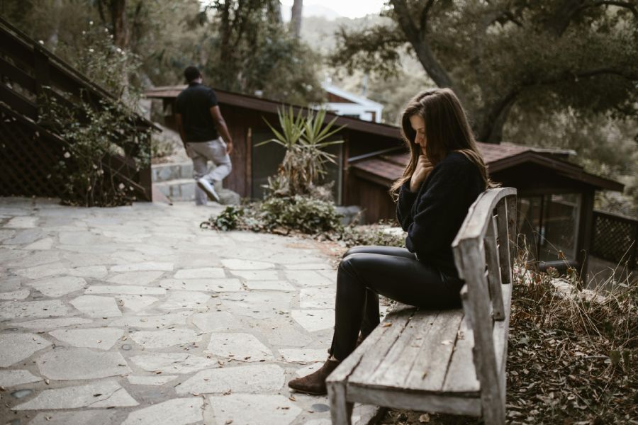 Sad woman sitting on a bench